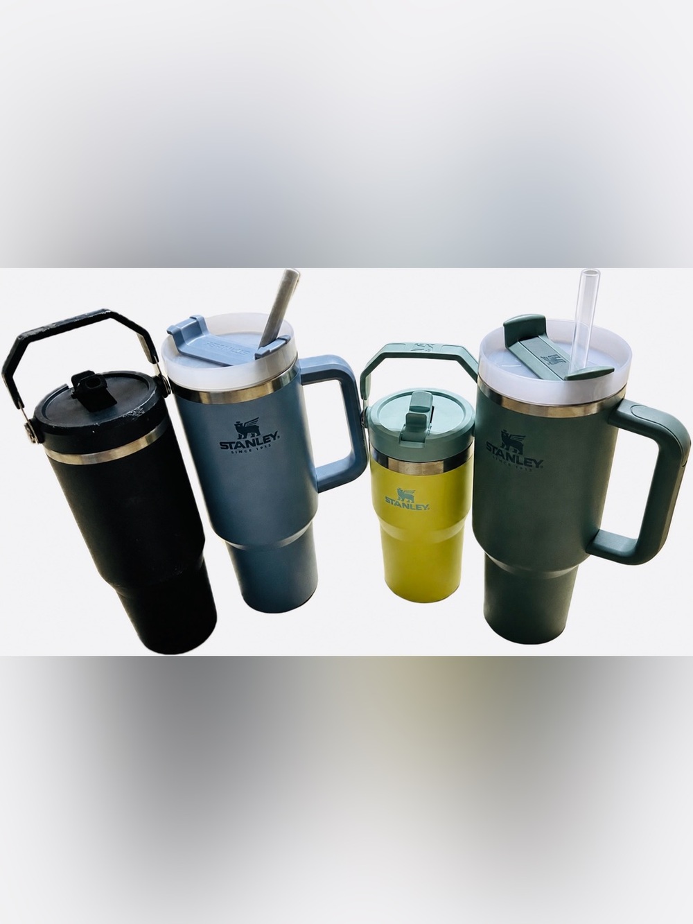 4 Stanley Cups - 2 40oz, 1 30oz, 1 20oz - blue, yellow, black, green.